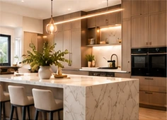 Warm wood kitchen cabinetry and a marble waterfall island.